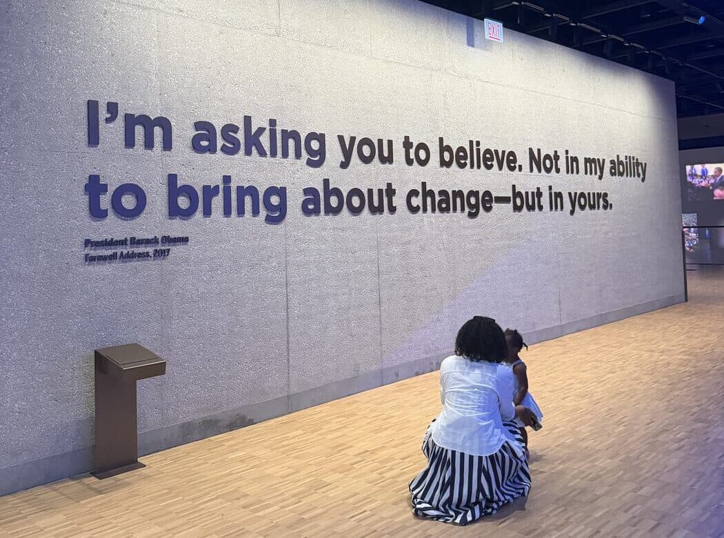 A wall carrying a quote from President Barack Obama's 2017 farewell address: I am asking you to believe. Not in my ability to bring about change, but in yours.